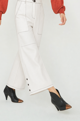 Black ankle boot with gold toe cap
